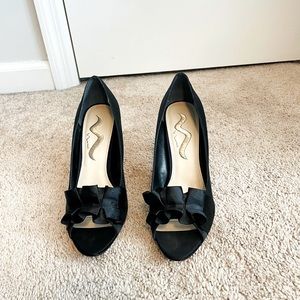 Brand new Nina Satin black pump with leather sole. Size 10.